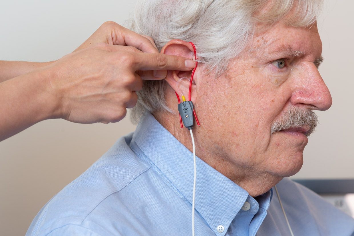 A senior man undergoing eardrum test at Pacific Hearing Service
