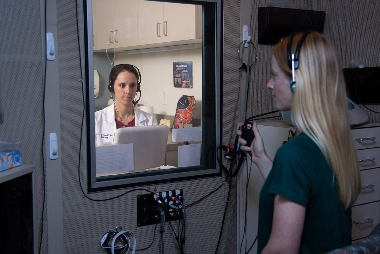 A young woman having a hearing evaluation at Pacific Hearing Service in Los Altos