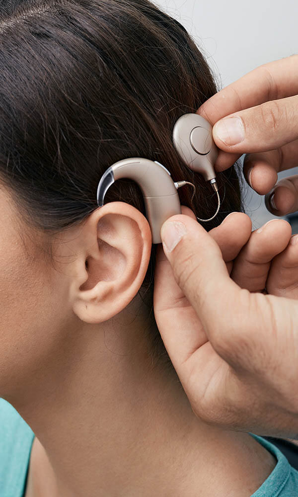 Man wearing a cochlear implant